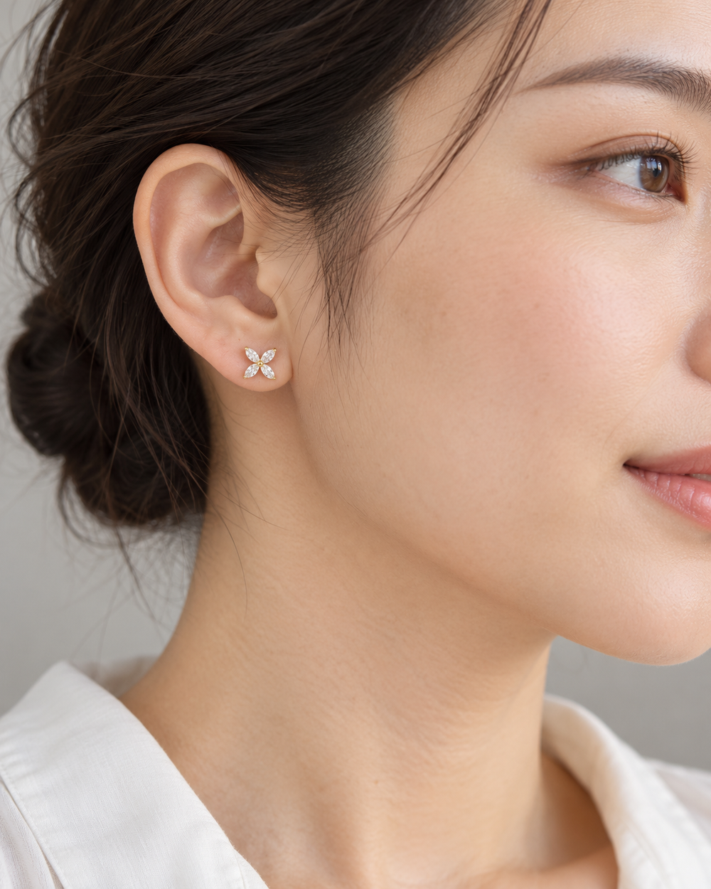 Four-Petal Studs — AI-generated wearing view